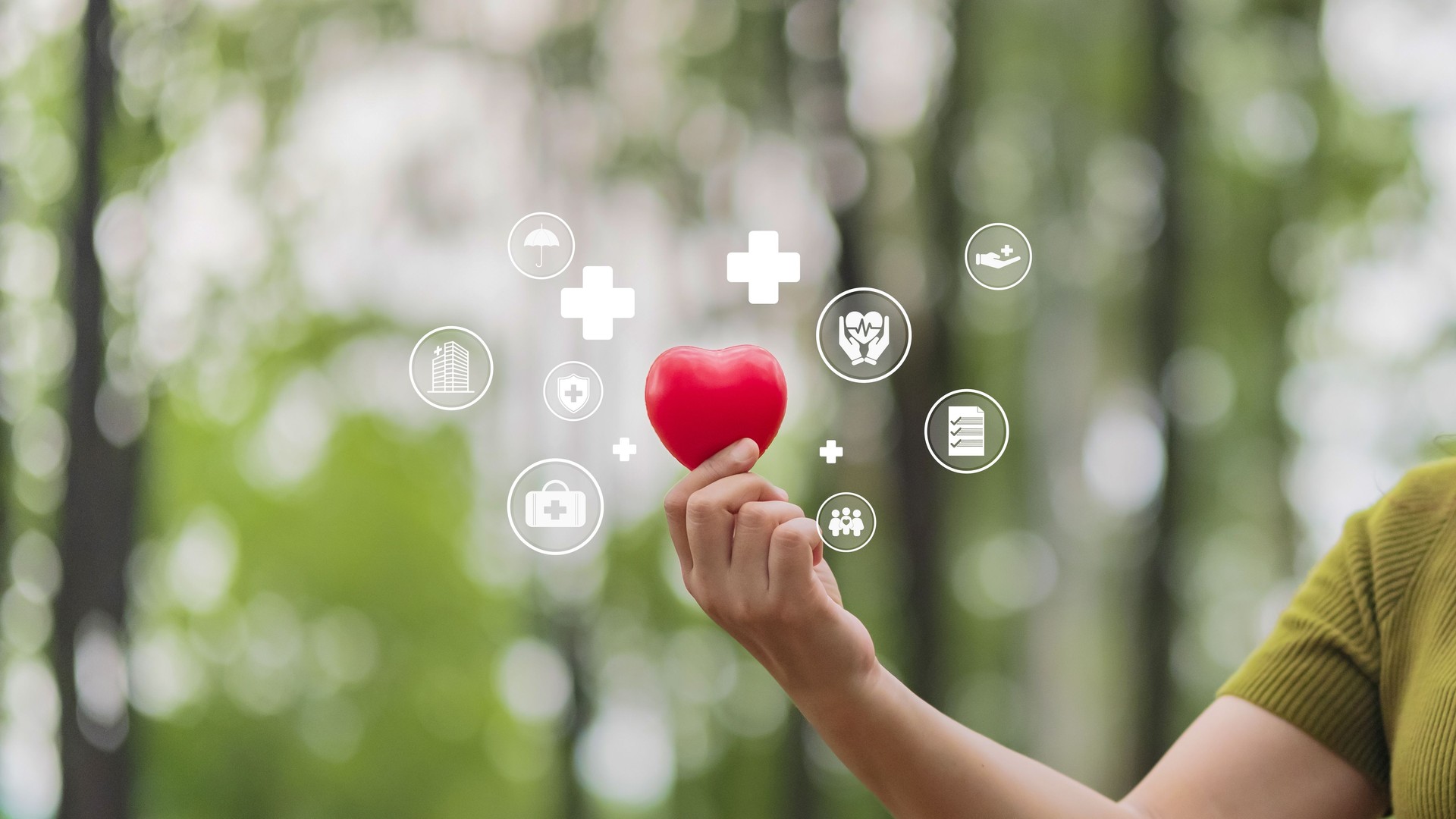 Woman holding heart for medical icon, concept of health insurance, family health care, access to health benefits and space for copying.